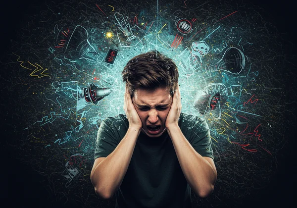 Person overwhelmed by bright lights, loud sounds, strong smells